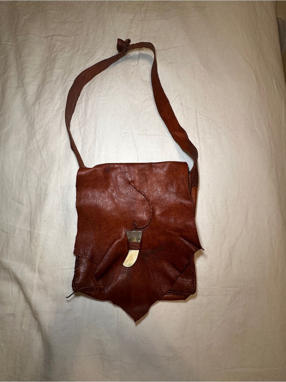 Handcrafted Brown Leather Crossbody Bag with Horn Accent